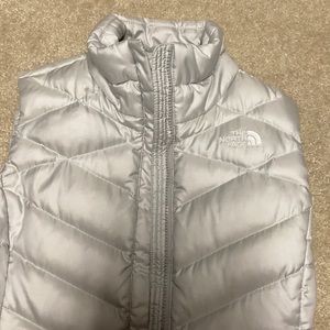 Woman’s down north face vest. Like new no damage pet and smoke free home